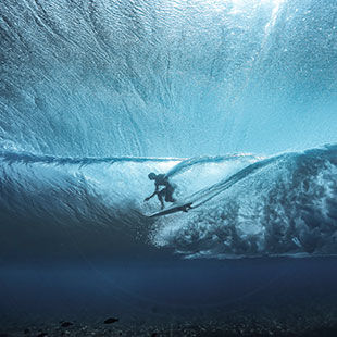 Surfer through the waves